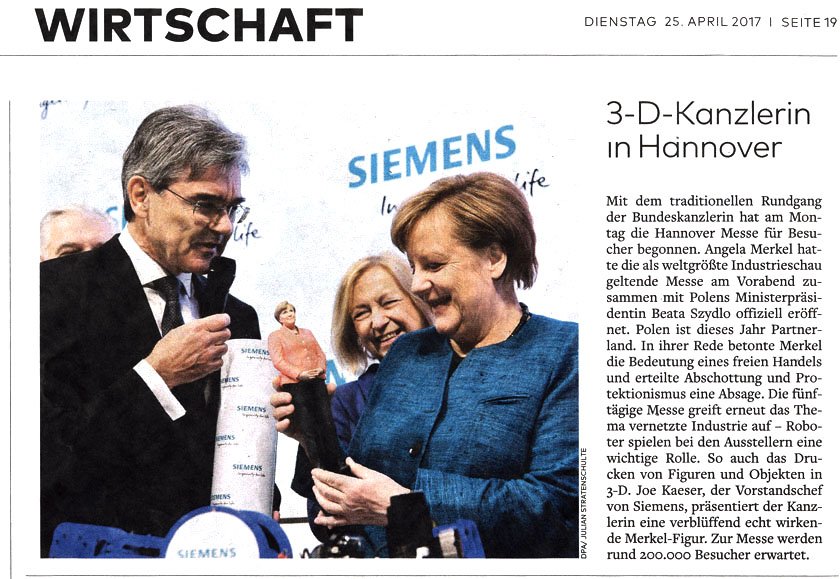 Merkel mit 3D- Merkelfigur von Ursula